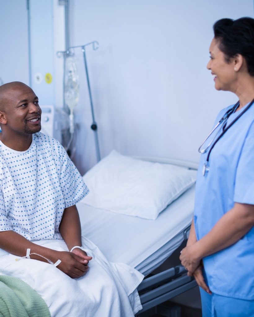 Nurse interacting with patient during visit